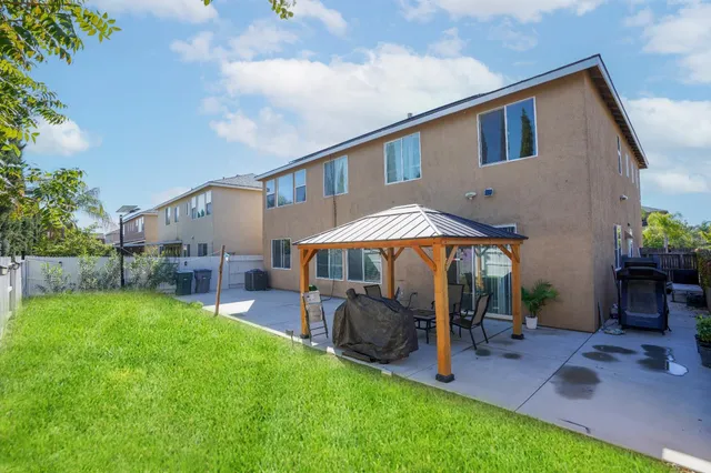 a view of a house with a yard porch and sitting area