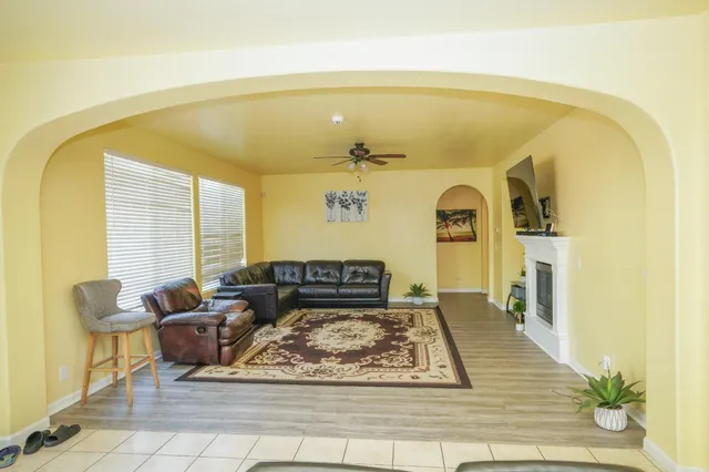 a living room with furniture and a rug
