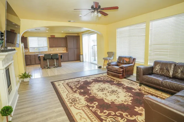 a living room with furniture and a rug
