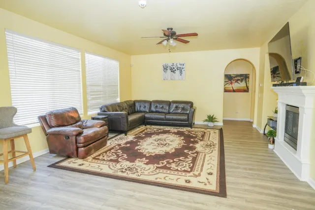 a living room with furniture and a fireplace