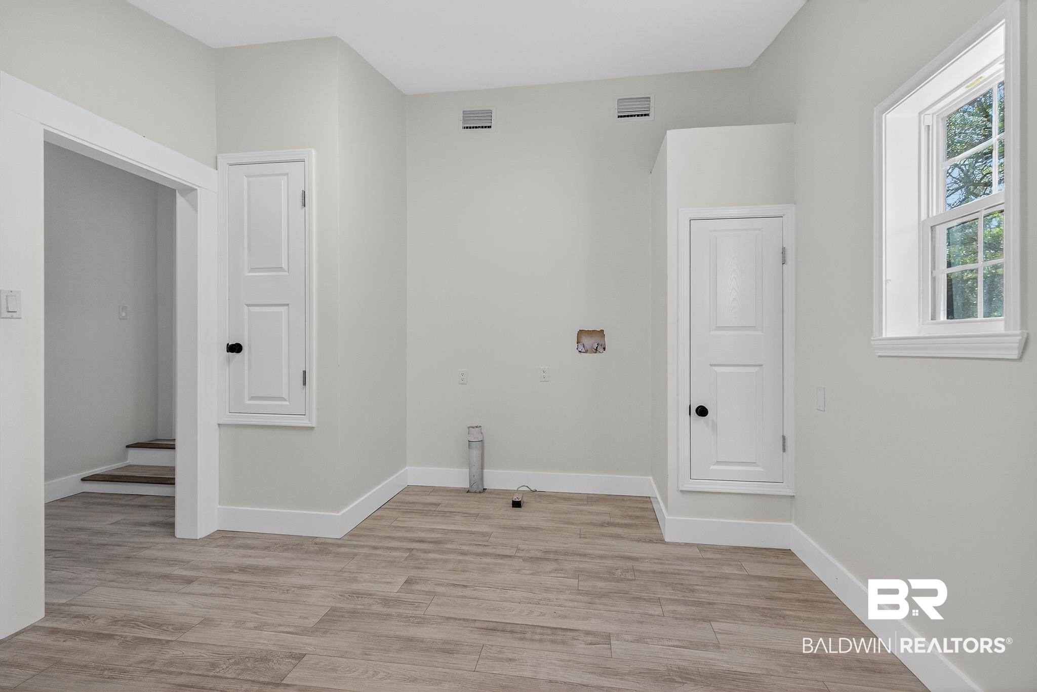 10650 Old Pascagoula Road Theodore, AL 36582 - Photo 55 of 77 Laundry area with light wood-style floors and hookup for a washing machine