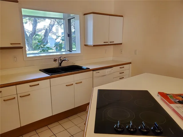 a utility room with sink dryer and washer