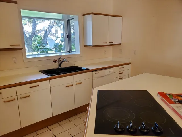 a kitchen with a sink and a cabinets