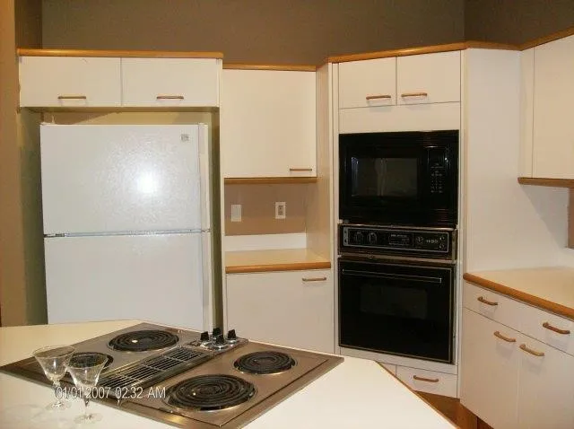 a kitchen with a stove and a microwave