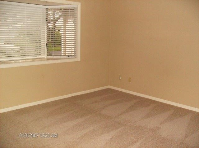 131 Peppertree Drive, Unit 21 Vero Beach, FL 32963 - Photo 20 of 25 an empty room with a window