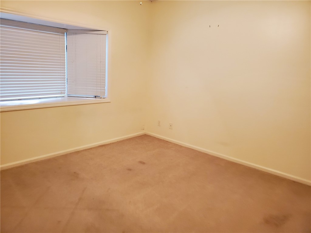 131 Peppertree Drive, Unit 21 Vero Beach, FL 32963 - Photo 2 of 25 an empty room with a window