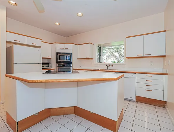 a view of a room with wooden floor and chandelier