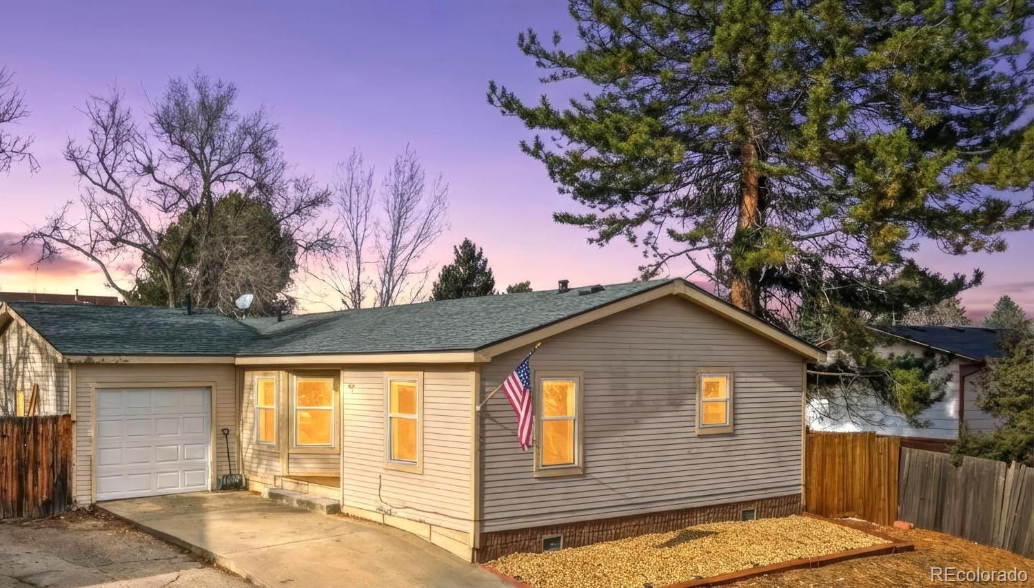 8137 Lafayette Street Denver, CO 80229 - Photo 1 of 36 a view of backyard of house