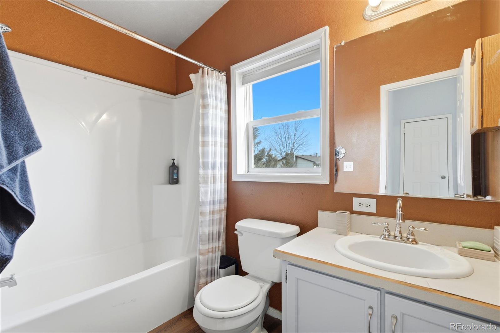 8137 Lafayette Street Denver, CO 80229 - Photo 23 of 36 a bathroom with a toilet a sink and a bathtub