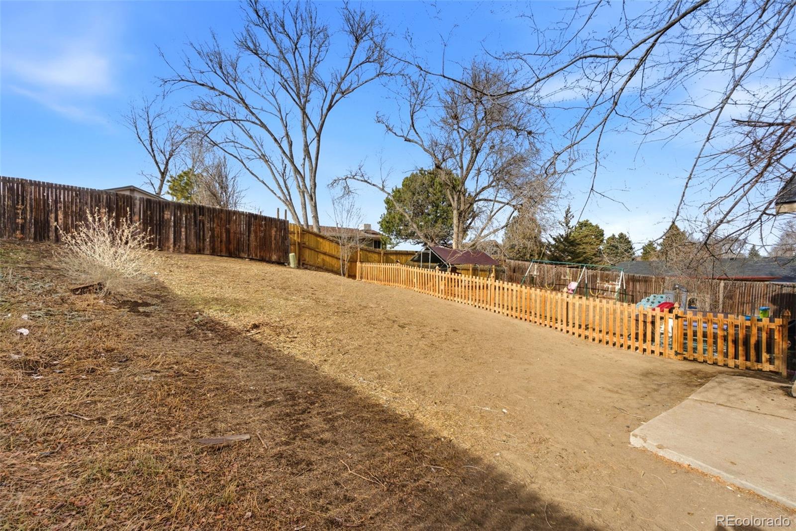 8137 Lafayette Street Denver, CO 80229 - Photo 27 of 36 a street view covered with snow