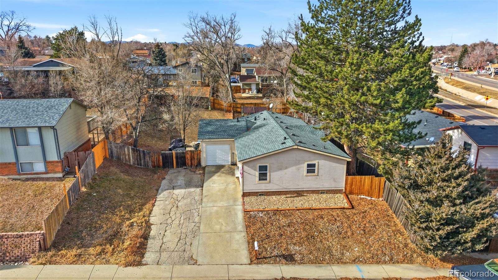 8137 Lafayette Street Denver, CO 80229 - Photo 29 of 36 aerial view of a house with a yard