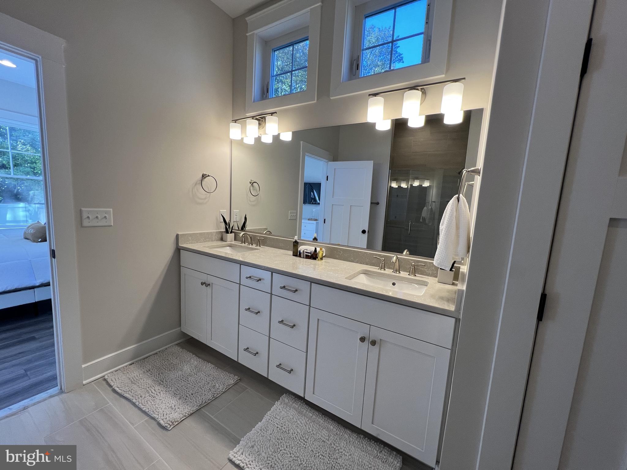 30491 Blue Beech Lane Frankford, DE 19945 - Photo 15 of 17 a bathroom with a double vanity sink and a mirror
