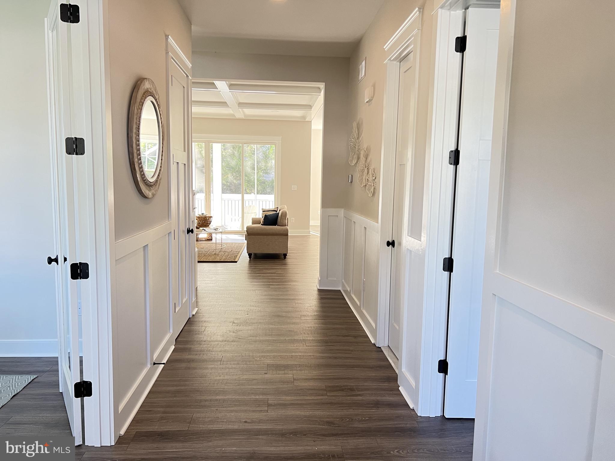 30491 Blue Beech Lane Frankford, DE 19945 - Photo 3 of 17 a view of a hallway with wooden floor and windows