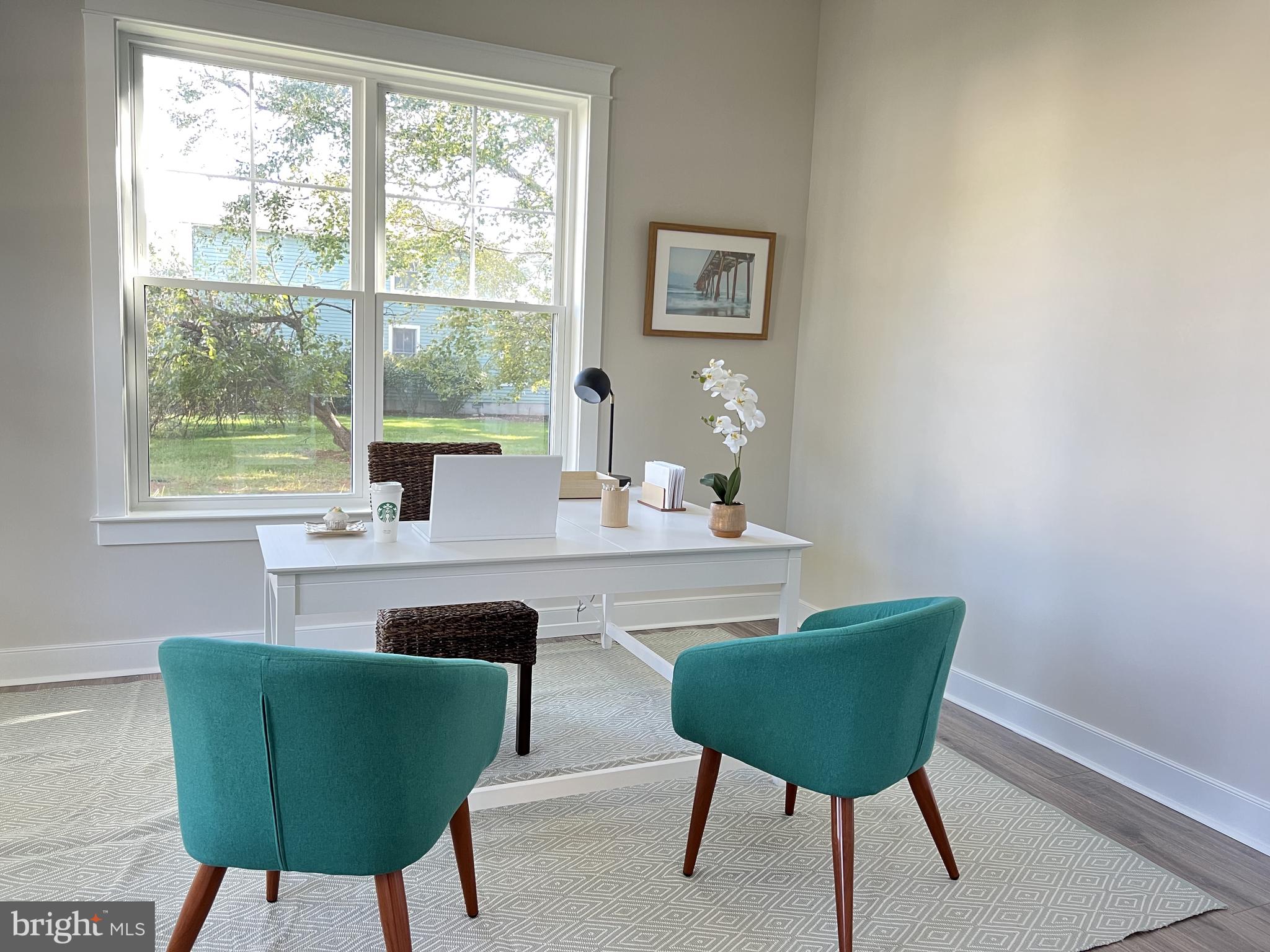 30491 Blue Beech Lane Frankford, DE 19945 - Photo 4 of 17 a kitchen with a table chairs and window