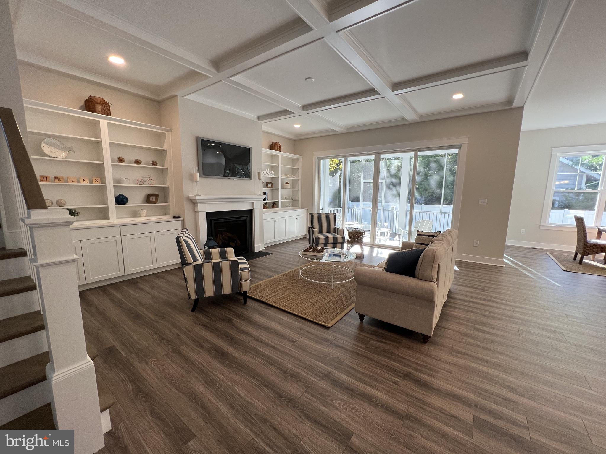 30491 Blue Beech Lane Frankford, DE 19945 - Photo 6 of 17 a living room with furniture a fireplace and a flat screen tv