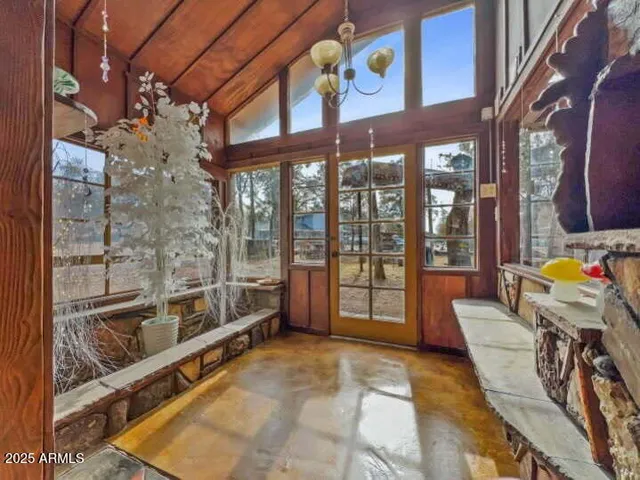 a view of a chairs and table in a patio