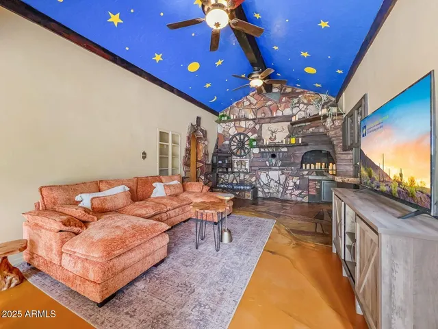 a kitchen with stainless steel appliances granite countertop a sink a stove cabinets and a window