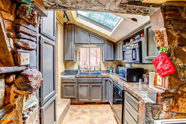 a bedroom with furniture and a large mirror