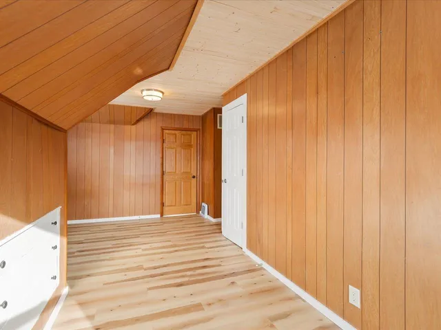 a view of gallery with wooden floor