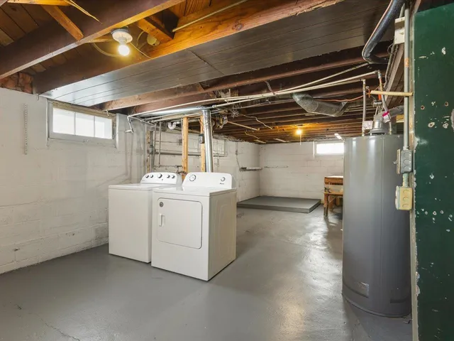 a view of storage and utility room with washer and dryer