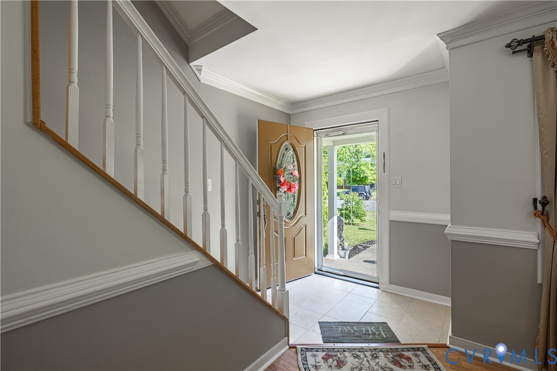 9217 Fisk Road Richmond, VA 23229 - Photo 5 of 39 a stairs and a window in a room