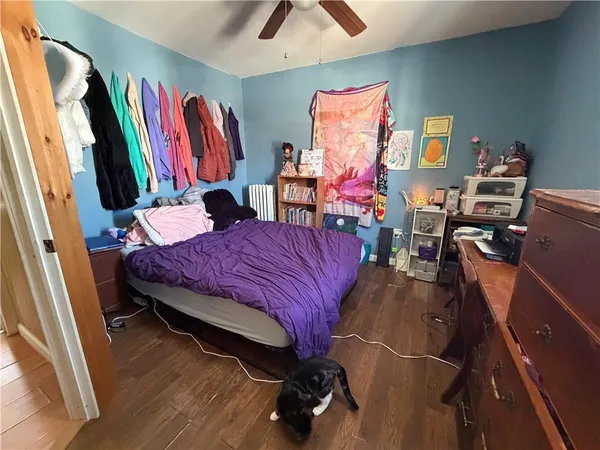 a bed room with a bed and a desk