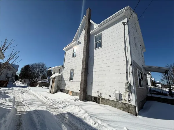 a view of a house with snow
