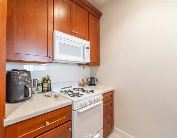 a kitchen with a stove and a microwave