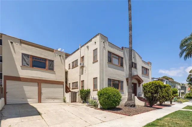 a front view of a building with garden