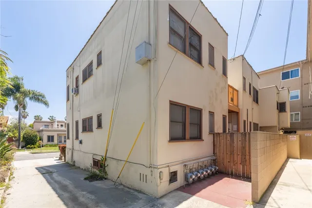 a view of a street with brick walls