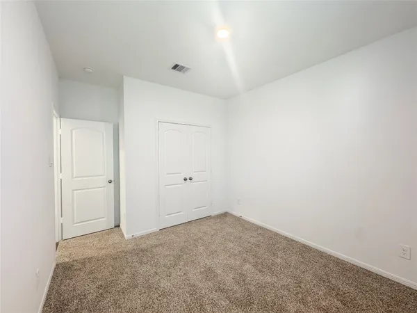 a view of storage and utility room with washer and dryer
