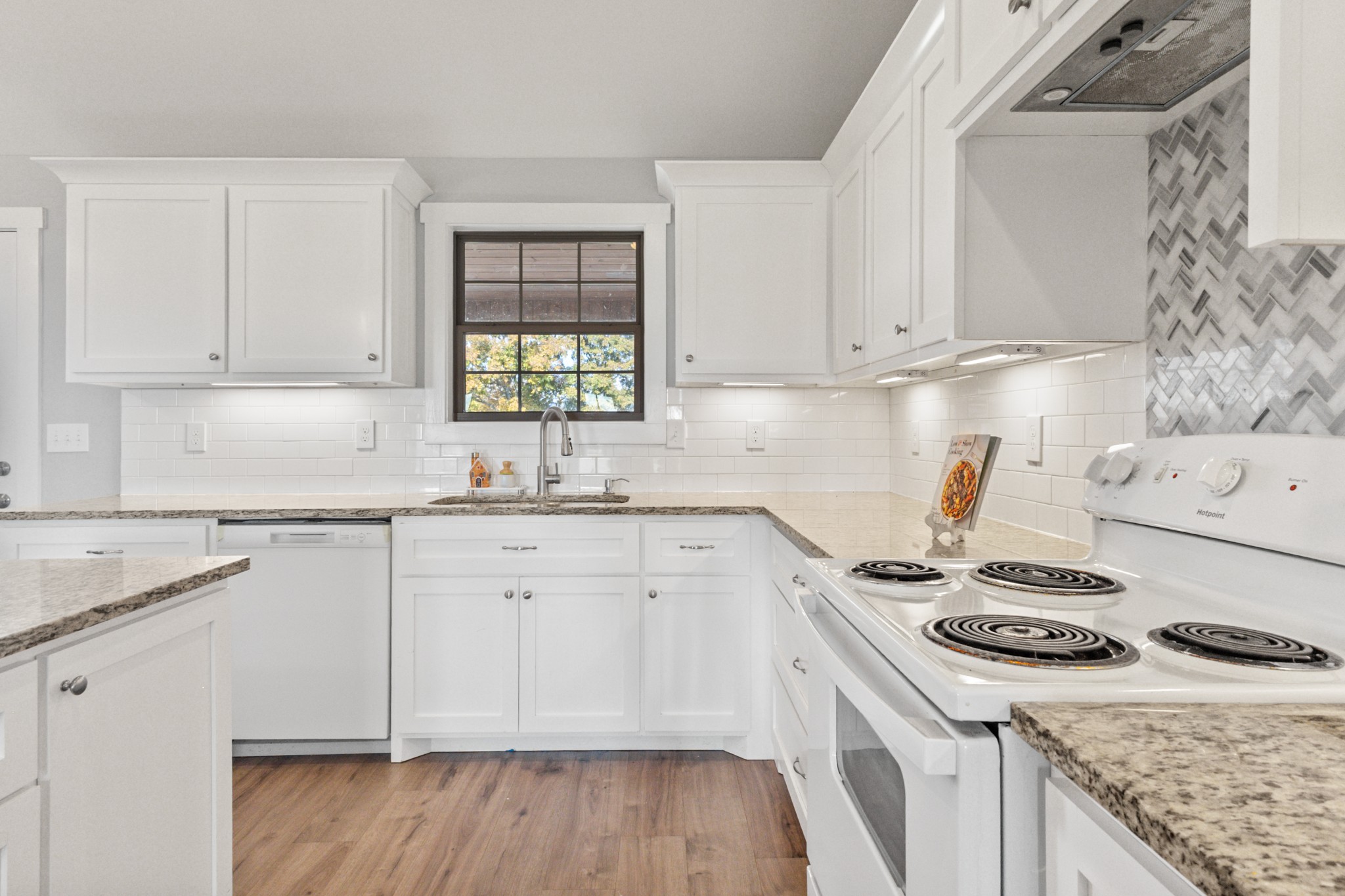 120 Freeland Road Portland, TN 37148 - Photo 13 of 61 a kitchen with granite countertop cabinets stainless steel appliances and a counter space