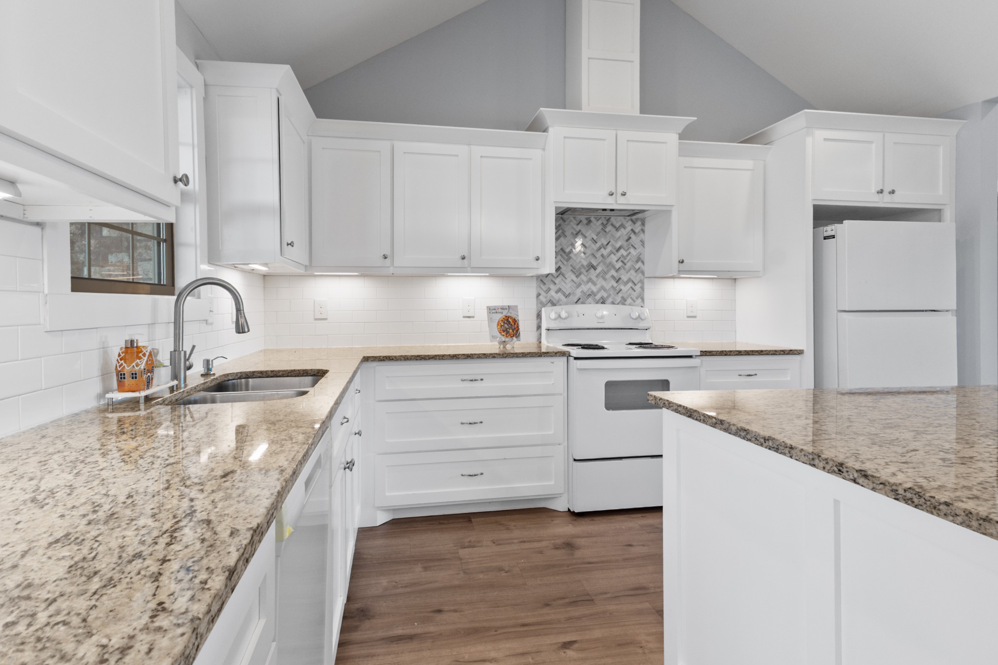 120 Freeland Road Portland, TN 37148 - Photo 15 of 61 a kitchen with granite countertop a sink stainless steel appliances and cabinets