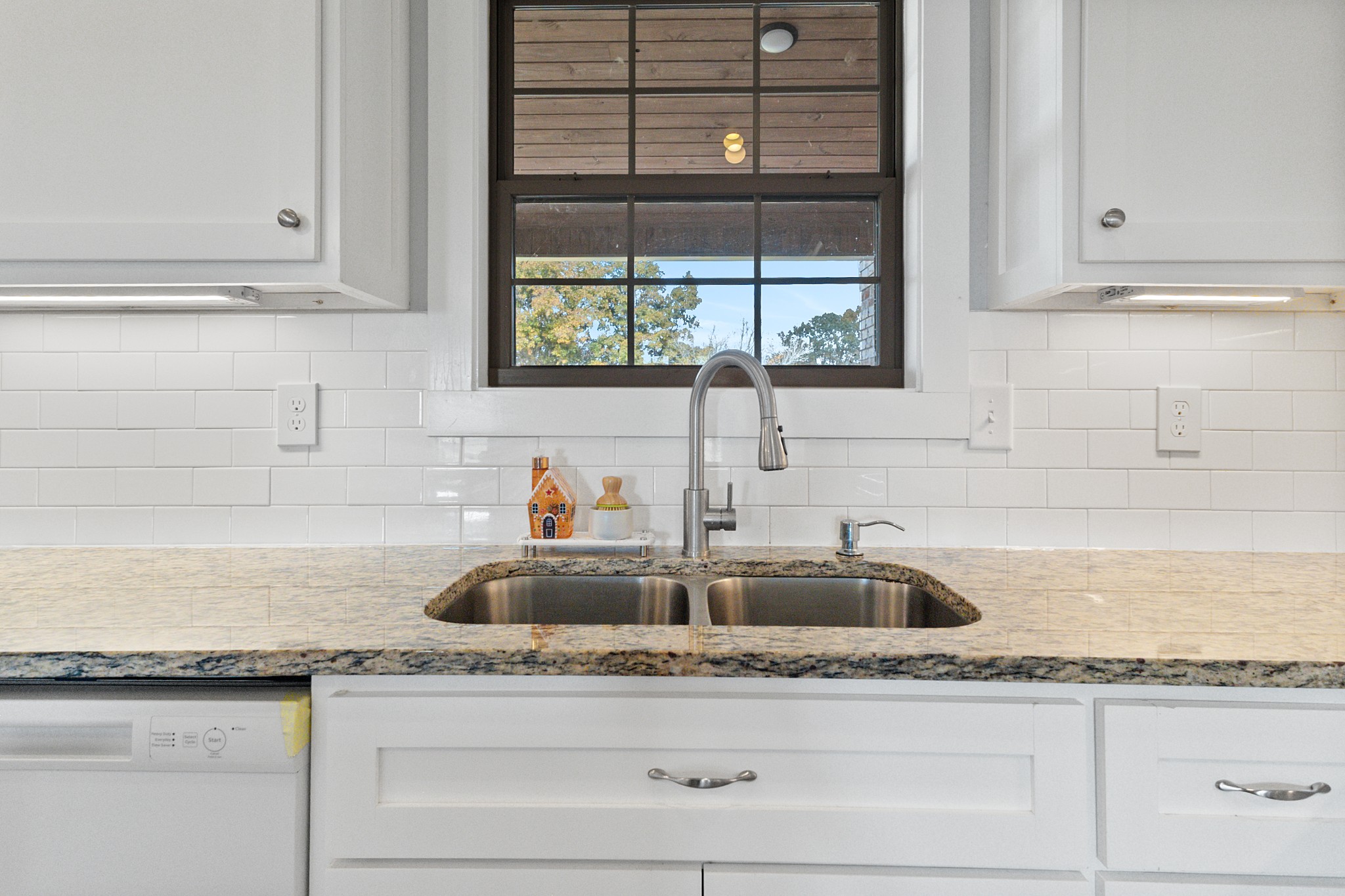 120 Freeland Road Portland, TN 37148 - Photo 16 of 61 a kitchen with granite countertop a sink and cabinets