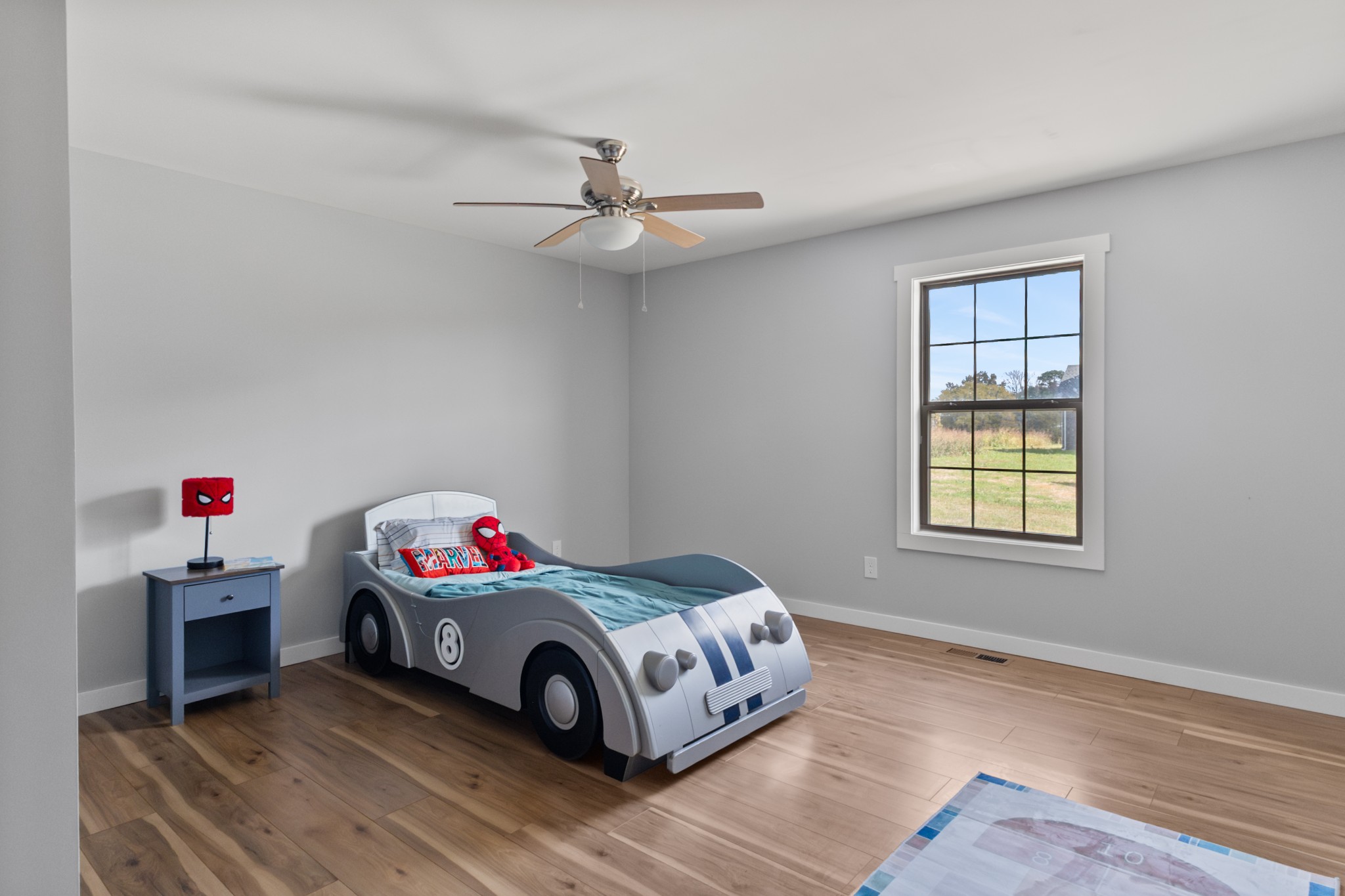 120 Freeland Road Portland, TN 37148 - Photo 24 of 61 a bedroom with a bed and a chandelier