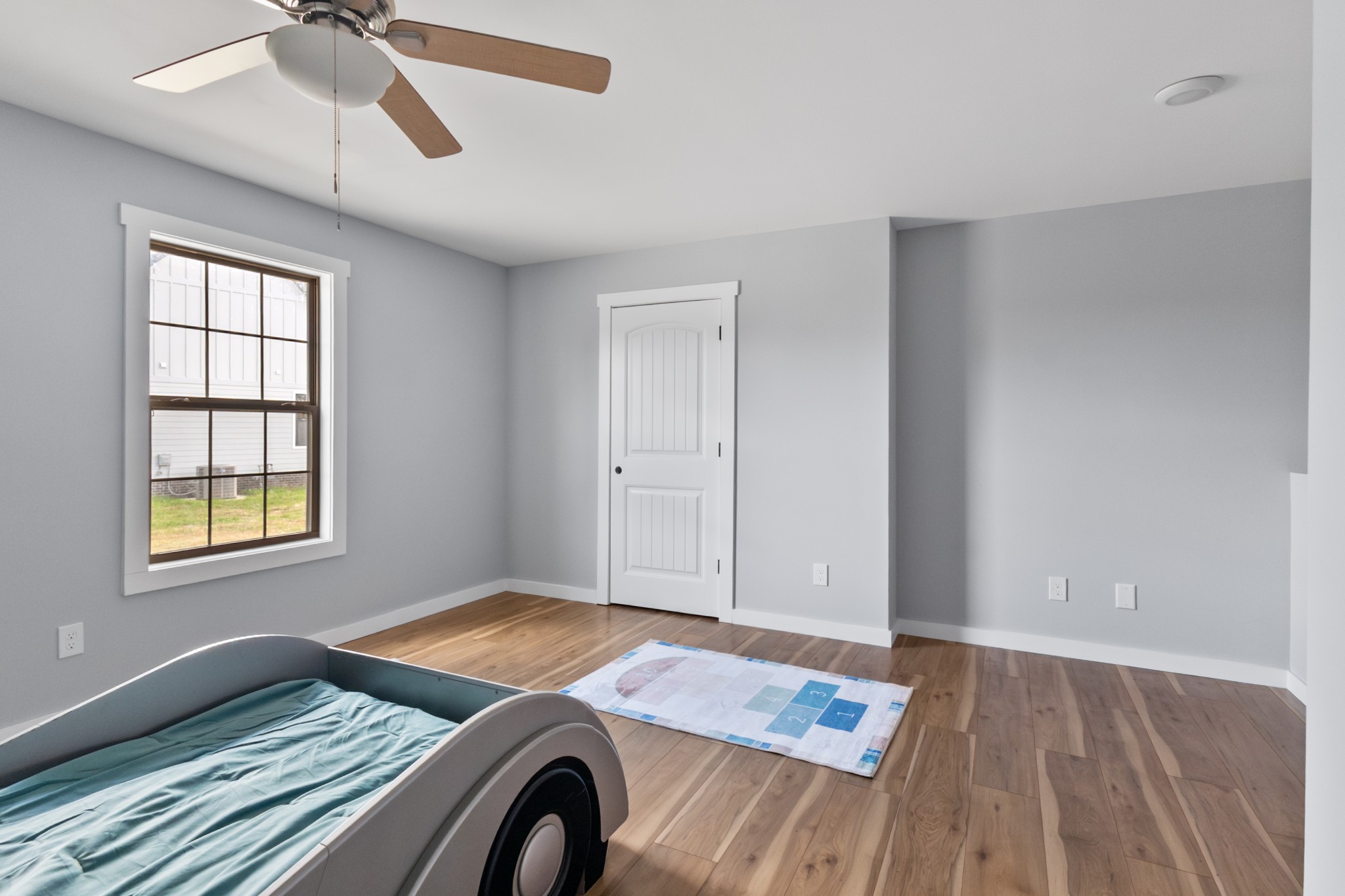 120 Freeland Road Portland, TN 37148 - Photo 27 of 61 a view of a livingroom with wooden floor and a ceiling fan