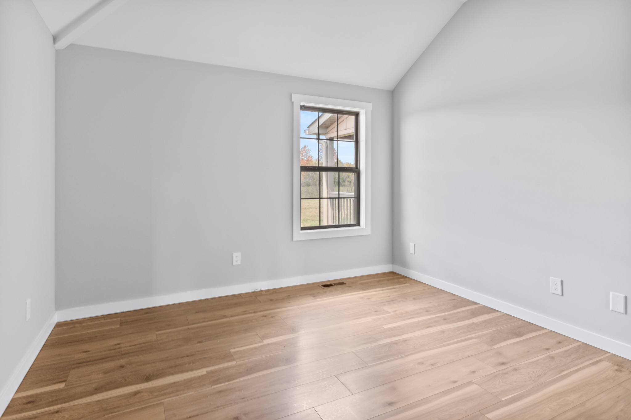 120 Freeland Road Portland, TN 37148 - Photo 38 of 61 an empty room with wooden floor and windows
