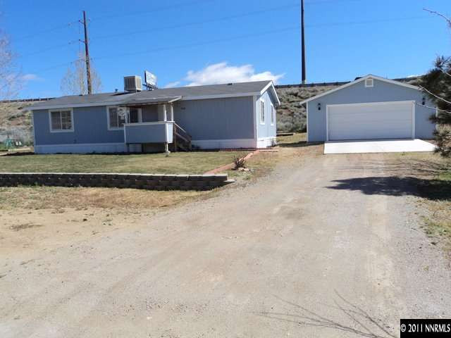 5600 West Ranger Road Reno, NV 89506 - Photo 1 of 10 a front view of a house with a yard