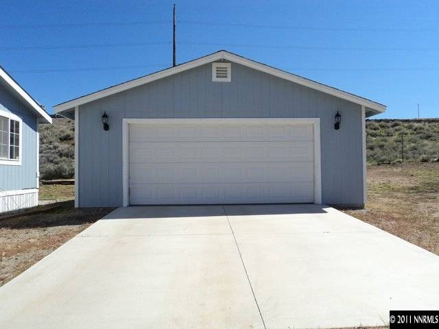 5600 West Ranger Road Reno, NV 89506 - Photo 2 of 10 a front view of a house with garage