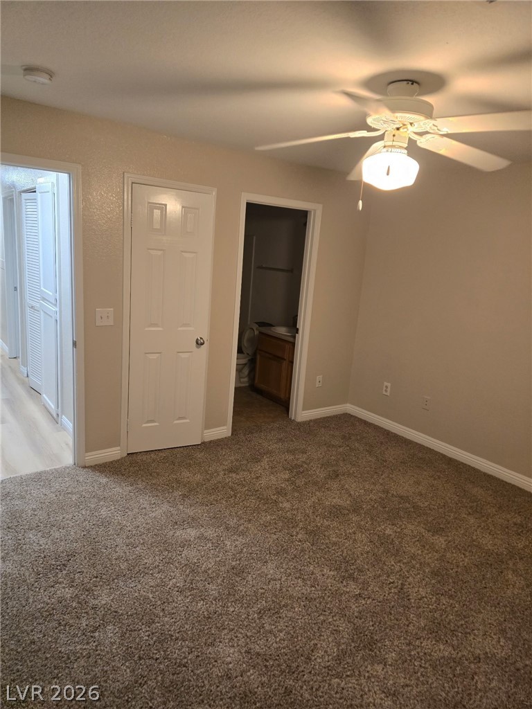 4730 East Craig Road, Unit 2142 Las Vegas, NV 89115 - Photo 4 of 8 This cozy bedroom features plush carpeting, a functional ceiling fan, and access to an adjacent bath.
