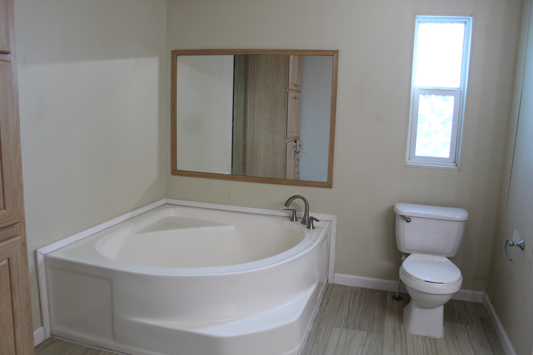 108 Wimbley Road Estill Springs, TN 37330 - Photo 11 of 27 a white toilet sitting next to a window