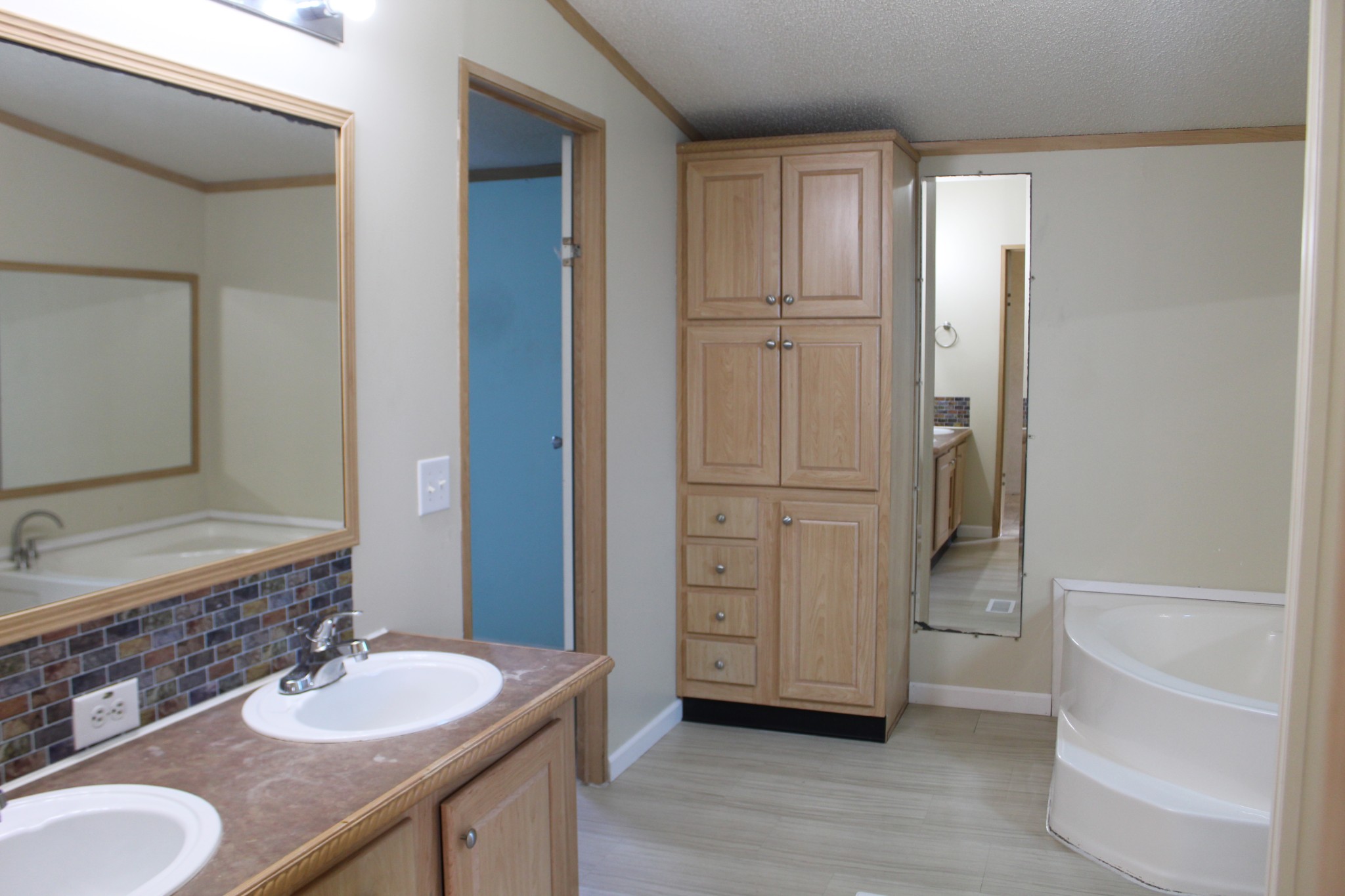 108 Wimbley Road Estill Springs, TN 37330 - Photo 12 of 27 a bathroom with a granite countertop sink and a mirror