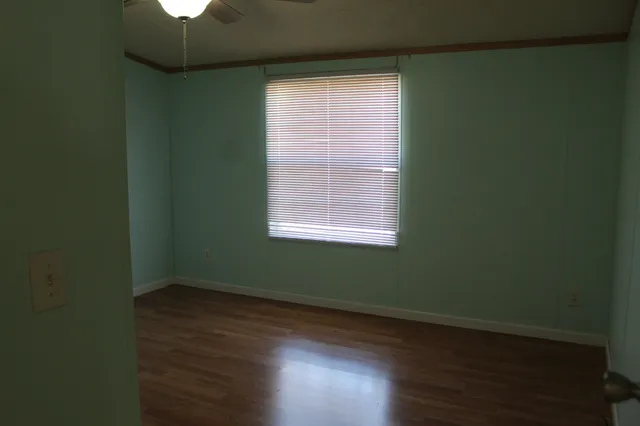 a view of a room that has a window in it