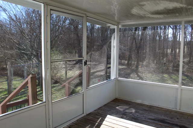 a bathroom with a glass shower door