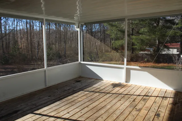 a view of wooden floor with a glass door