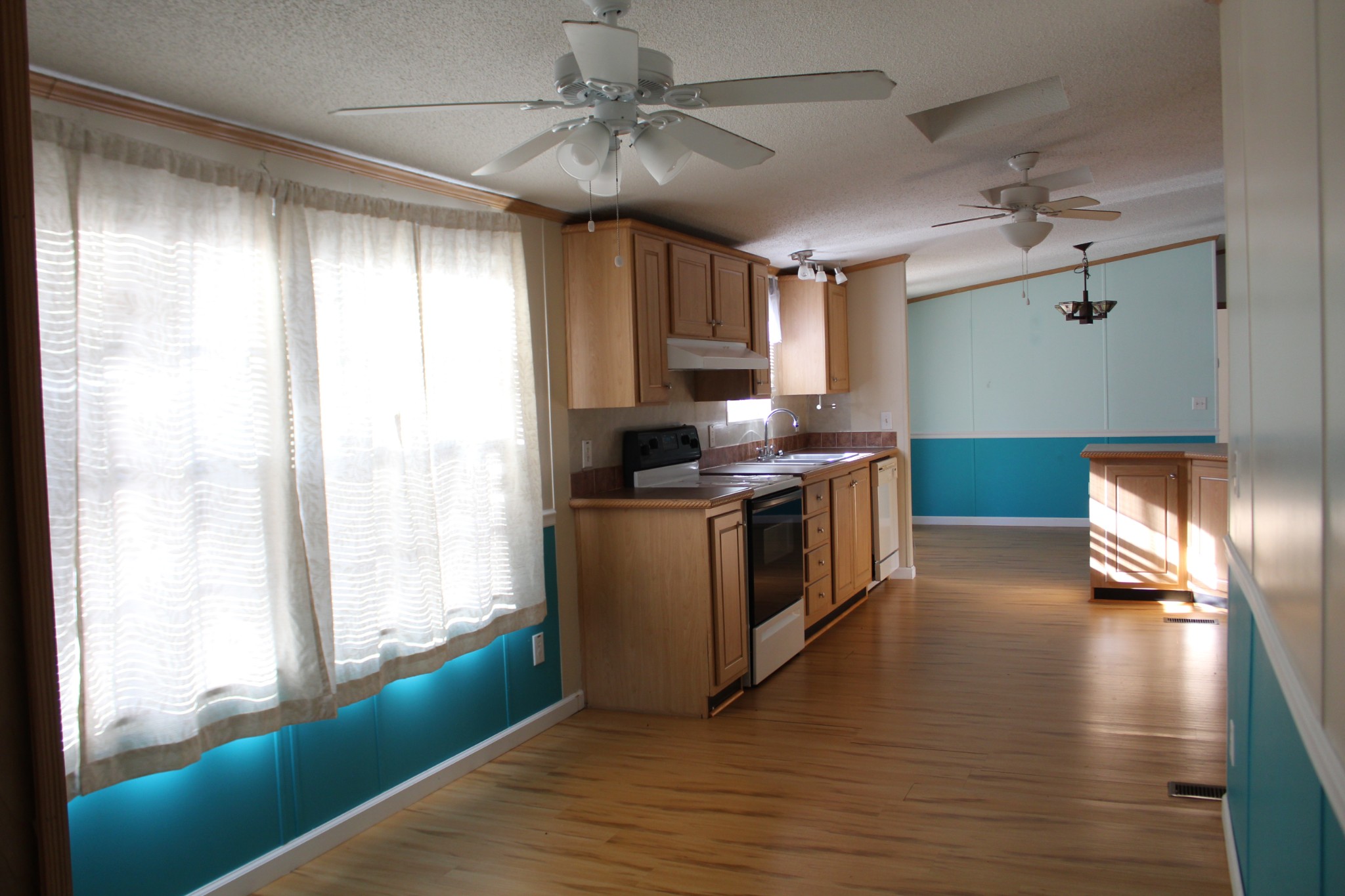 108 Wimbley Road Estill Springs, TN 37330 - Photo 7 of 27 a kitchen with granite countertop a stove and a window