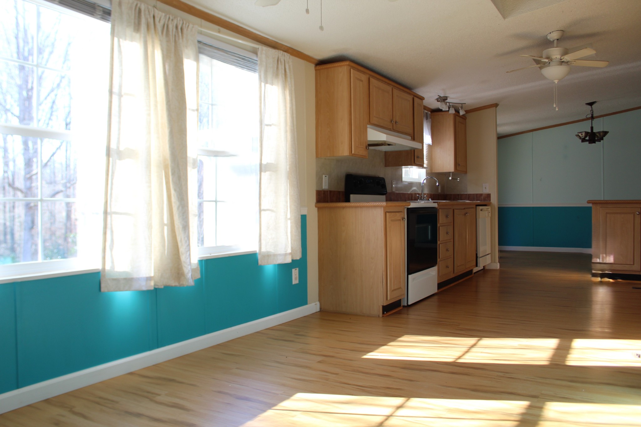 108 Wimbley Road Estill Springs, TN 37330 - Photo 8 of 27 a kitchen with a sink wooden floor and a window