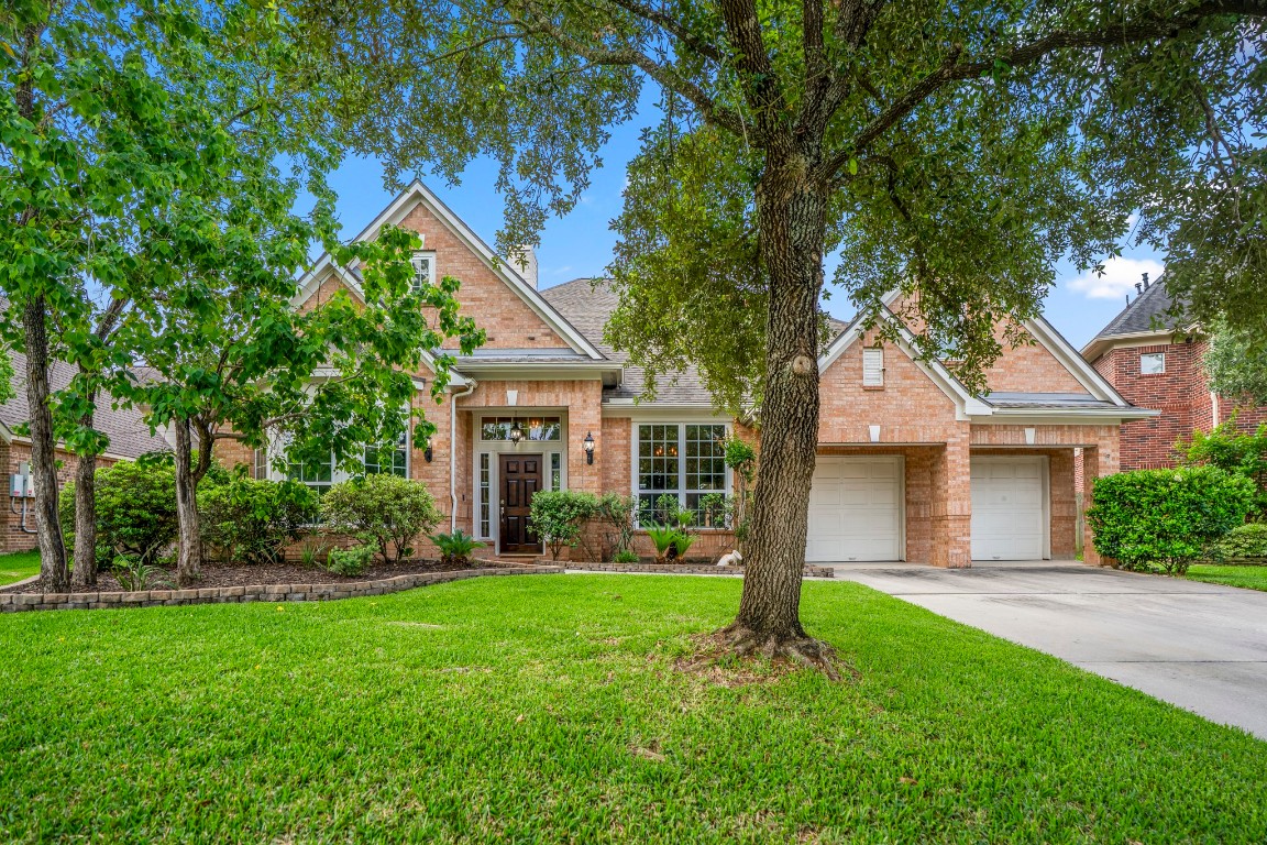 Welcome home to 6811 Pinehearth Court, nestled on a cul-de-sac street in the golf course community of Windrose!