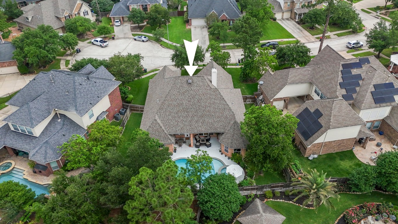 6811 PInehearth Court Spring, TX 77379 - Photo 2 of 50 Set on a spacious cul-de-sac lot in Windrose, the backyard centers around a beautifully updated pool and spa, with a covered patio that extends the living space outdoors.
