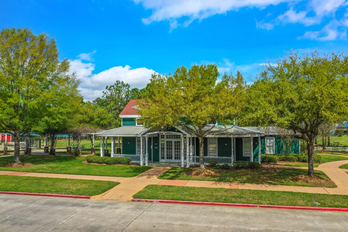 6811 PInehearth Court Spring, TX 77379 - Photo 41 of 50 Windrose boasts beautifully designed clubhouse surrounded by lush courtyards, inviting benches, and scenic walking trails. A perfect setting for gatherings!